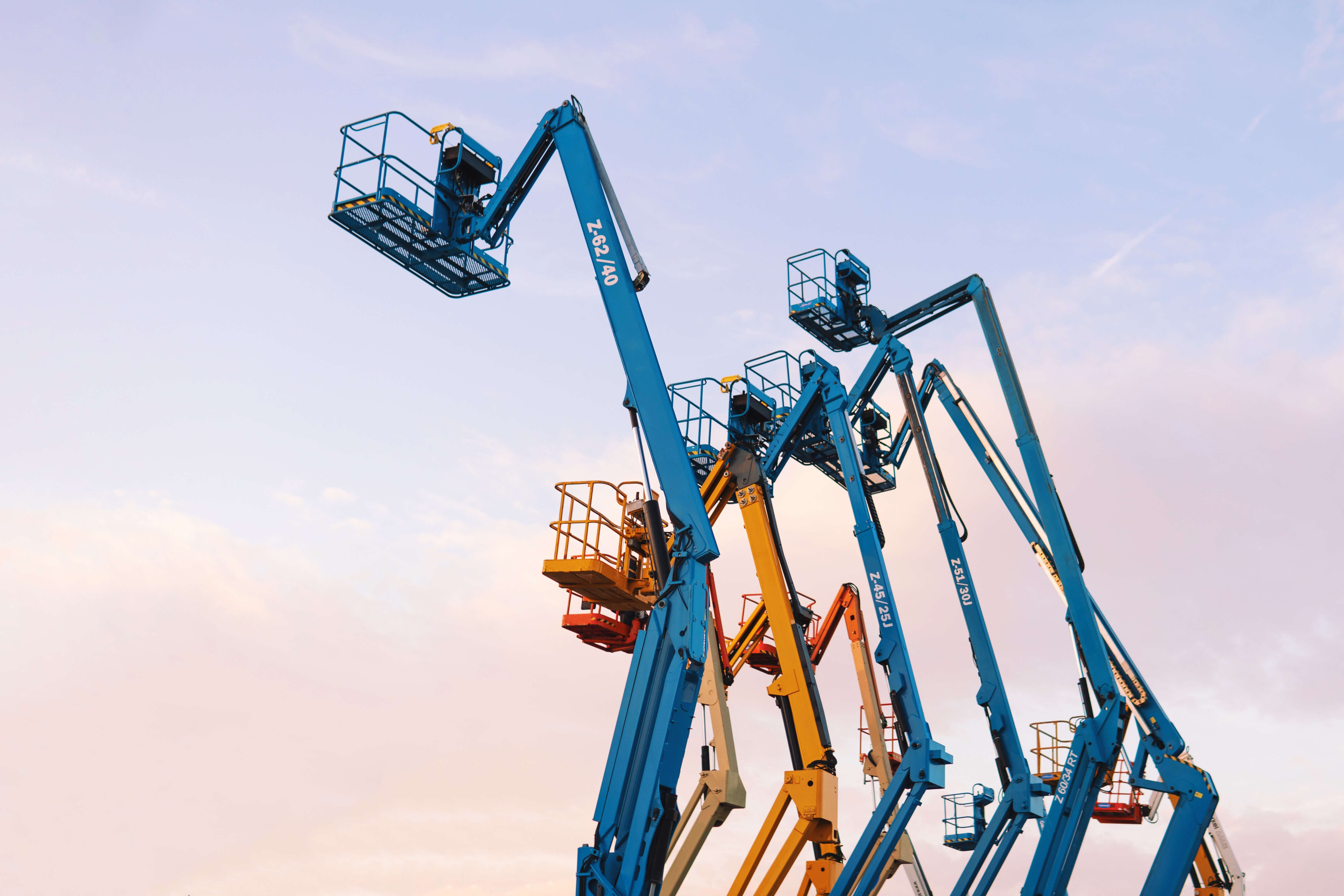 colourful cranes at sunset